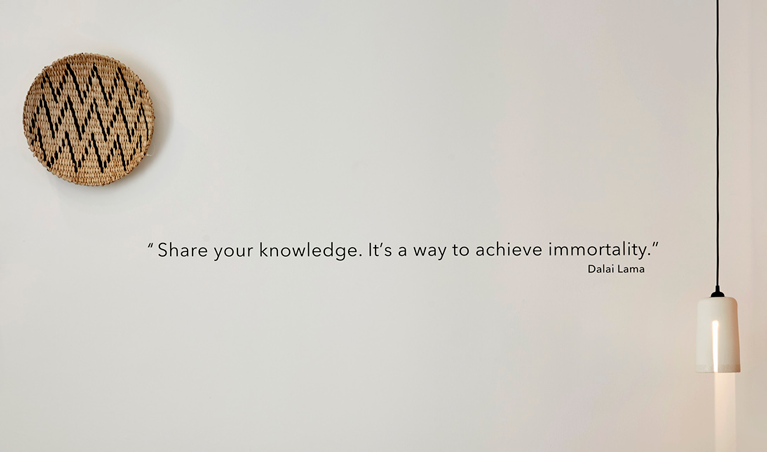 Quote about knowledge that decorate the interior of a themed hotel. Text and typography by The Blank Sheep